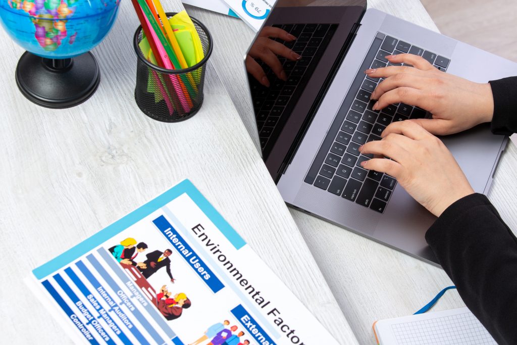 Front View Girl Using Laptop Front Table With Schedules Graphics Using Laptop Job Business Activity 1024x683
