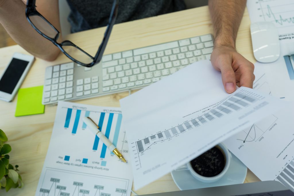 Hand Male Graphic Designer Holding Graph Document 1024x683