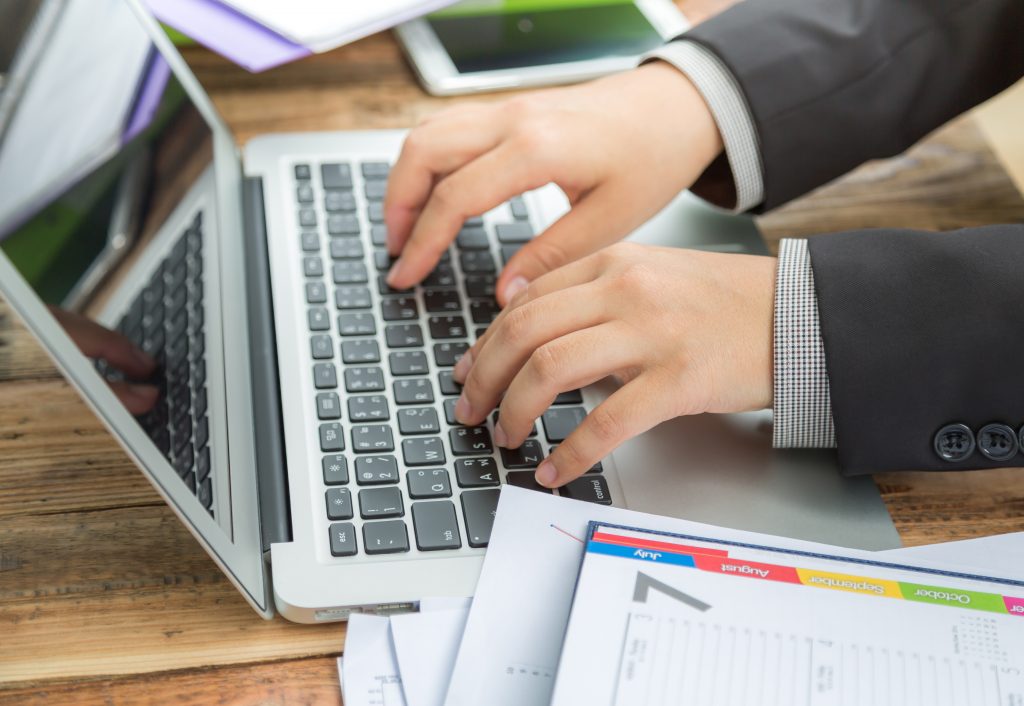 Businessman Writing Laptop 1024x706